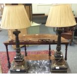 A pair of gilt metal and marble table lamps
