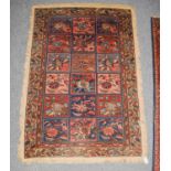 Bakhtiari rug, the compartmentalised polychrome field of flowers enclosed by angular vine borders,