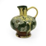 An Art Nouveau Faience de Purmerend Pottery Jug, painted with blue/grey flowers, on a yellow ground,