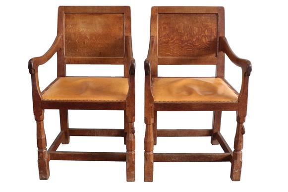 Workshop of Robert Mouseman Thompson (Kilburn): A Pair of English Oak Panel-Back Armchairs, tan hide