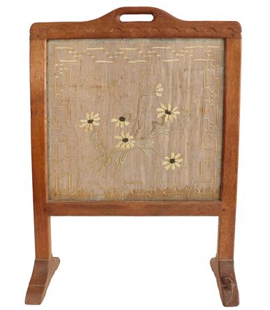 Robert Mouseman Thompson (1876-1955): An English Oak Firescreen, with carrying aperture and penny