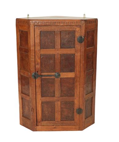 Robert Mouseman Thompson (1876-1955): An English Burr Oak Panelled Hanging Corner Cupboard, 1930'