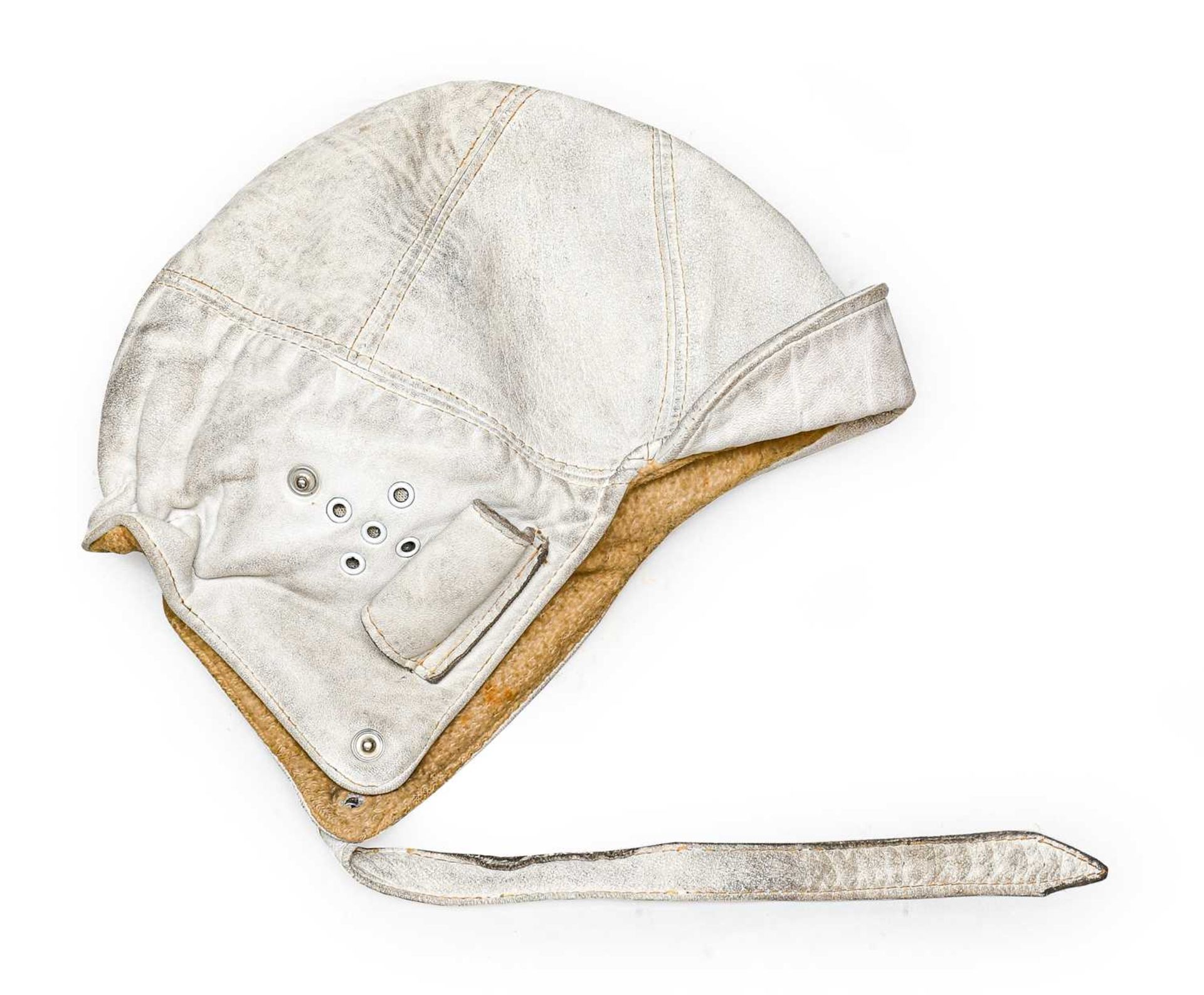 A Vintage White Leather Driver's Helmet, with double stitched seams, soft peak, rolled ear flaps and