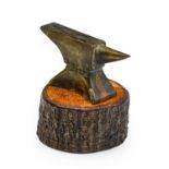A Bronzed Car Mascot, stamped Vulcan, as an anvil, mounted on a wooden base, 5.5cm high
