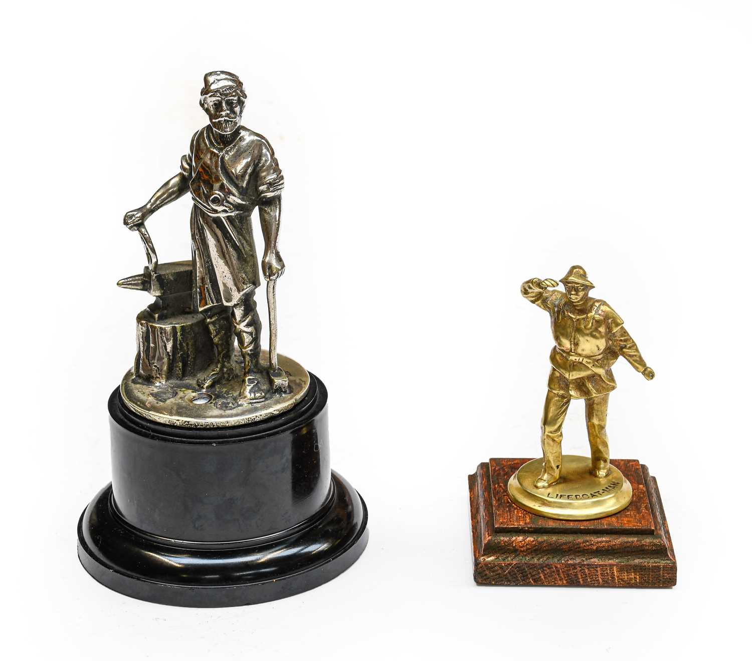 A Brass Radiator Lifeboatman Car Mascot, mounted on a stained wooden base, 9cm high; and A Vulcan