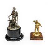 A Brass Radiator Lifeboatman Car Mascot, mounted on a stained wooden base, 9cm high; and A Vulcan