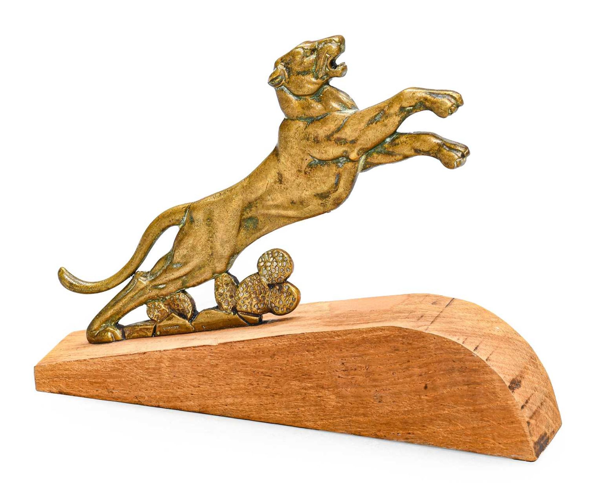 A Bronzed Accessory Mascot, as an outstretched lion, mounted on a wooden base