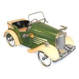 A 1930’s Tri-ang Metal-Bodied Open Roadster Pedal Car, repainted green and yellow, with chromed