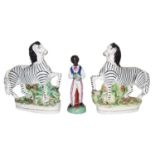 A pair of 19th century Staffordshire flatback models of Zebras; together with a Staffordshire