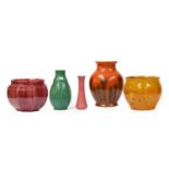 Three Pilkington's pottery vases of varying form, orange vermillion and black, tall green vase