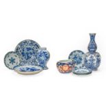 A quantity of 18th century and later Continental Delft, including chargers, vases, pancake plate,