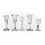 Five Georgian glasses comprising three wine glasses, one having double opaque and red twist stem,