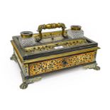 An early 19th century brass inlaid desk stand, incorporating a pair of glass inkwells with a