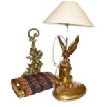 A brass figured table lamp with shade in the form of an Eagle, a brass doorstop in the form of a