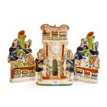 A Victorian Staffordshire pottery figural spill vase, formed as a chimney piece, the mantel set with