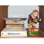 A tin plate guitar playing monkey, a Branko mechanical acrobat Japenese boxed toy, two boxed Corgi