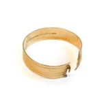 A 9 carat gold bangle, inner measurements 5.7cm by 5.4cmCondition report: Gross weight 27.1 grams.