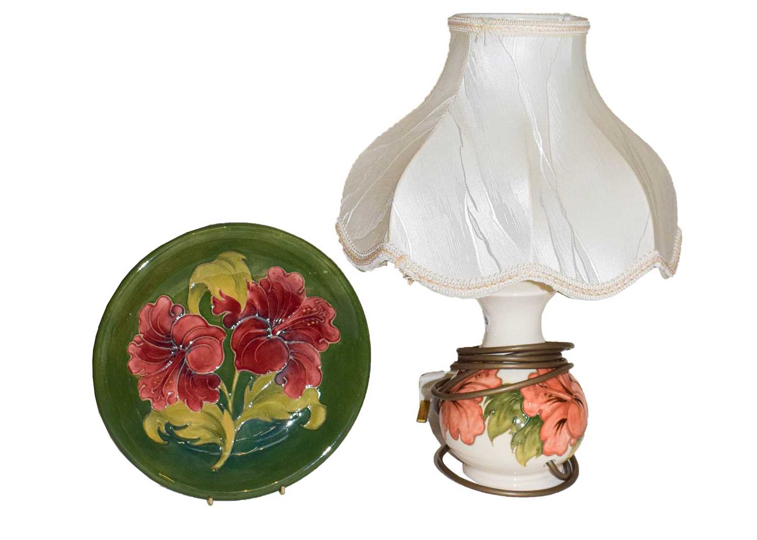 A Walter Moorcroft coral hibiscus lamp and a Walter Moorcroft hibiscus plate (2)