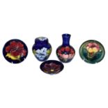 Five pieces of Moorcroft pottery, to include a Hibiscus pattern ginger jar and cover, a similar