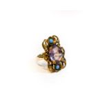 An adapted purple and blue stone ring, finger size N1/2Condition report: The ring head appears to be