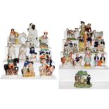 A collection of mainly Victorian Staffordshire pottery figures including a tithe group; together