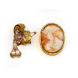 An amethyst bow brooch, unmarked, drop length 4.9cm; and a cameo brooch/pendant, measures 5.5cm by