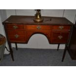 A group of furniture comprising an Edwardian centre table, a Georgian commode (converted to a