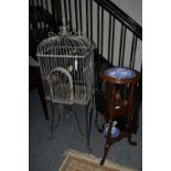 A late 20th-century mahogany pedestal washstand in the Georgian style, a modern birdcage, a mid-