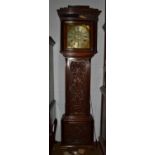 An oak eight-day longcase clock, dial inscribed Major Scholfield, Salford, later carved case,