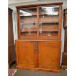 A mid 20th-century pitch pine part-glazed university/school bookcase 158cm by 54cm by 222cmCondition