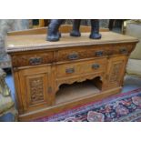 A late Victorian carved oak sideboard 174cm by 60cm by 106cm