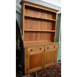 A Victorian pine kitchen dresser, the shelved...