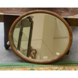 A reeded and gilt-framed oval mirror 65cm by 56cm