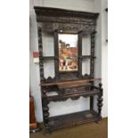 A Victorian carved oak mirrored hallstand 119cm by 38cm by 210cm