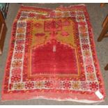 Anatolian prayer rug, the plain raspberry field beneath the Mihrab enclosed by flowerhead borders,