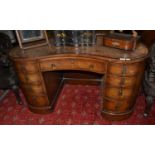 A mahogany and leather inset reniform desk, circa 1920s, 140cm by 75cm by 73cm