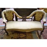 A Victorian part upholstered double back sofa with carved mahogany frameCondition report: Some