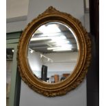 A 19th century gilt framed oval mirror, 57cm...