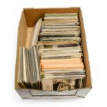 A box containing a mix of subject and topographical cards including Bamforth Song Cards and a