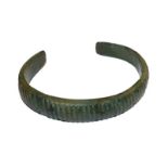 A Roman bronze torque bangle with reeded decoration, 8cm wide