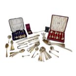 A collection of assorted silver flatware of various patterns, including a George IV silver basting
