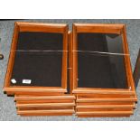 Eight glazed wooden framed collectors bijouterie cases, 99cm by 47cm