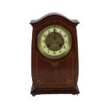 An Edwardian mahogany inlaid mantel clock