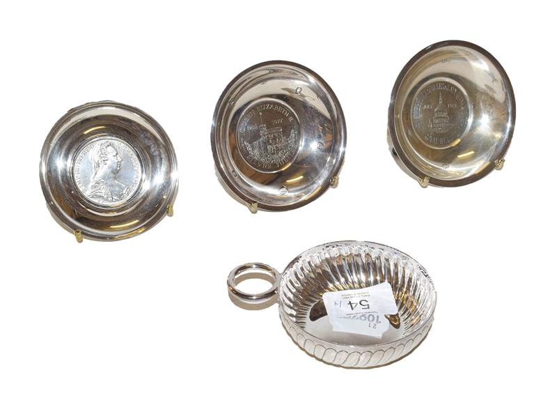 Three modern silver dishes and wine taster of typical form, each dishes circular, one
