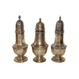 Three various sugar casters, comprising two octagonal examples, each with pull-off cover, one by