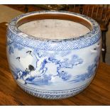 An early 20th century Japanese Arita blue and white porcelain planter, decorated with a continuous