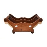 A 19th century mahogany cheese cradle with turned handles and raised on ball feet, 43cm by 24cm by