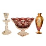 A Baccarat candlestick, ruby glass centrepiece and a gilded glass vase