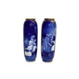 A pair of Royal Doulton vases from the blue children series with gilt rims, printed marks, 22cm (2)