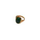A malachite ring, stamped '18K750', finger size P. Gross weight 3.7 grams.